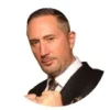 Professional portrait of TixTown co-founder in business attire, representing the event management and monetization platform leadership